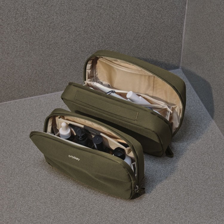 Both pouches open with full-size and travel toiletries